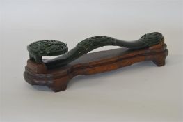 A large 20th Century green jade Ruyi on stand carv