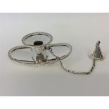 A small boat shaped silver chamber stick and snuffer with