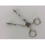 A pair of Georgian silver sugar scissors of typical form