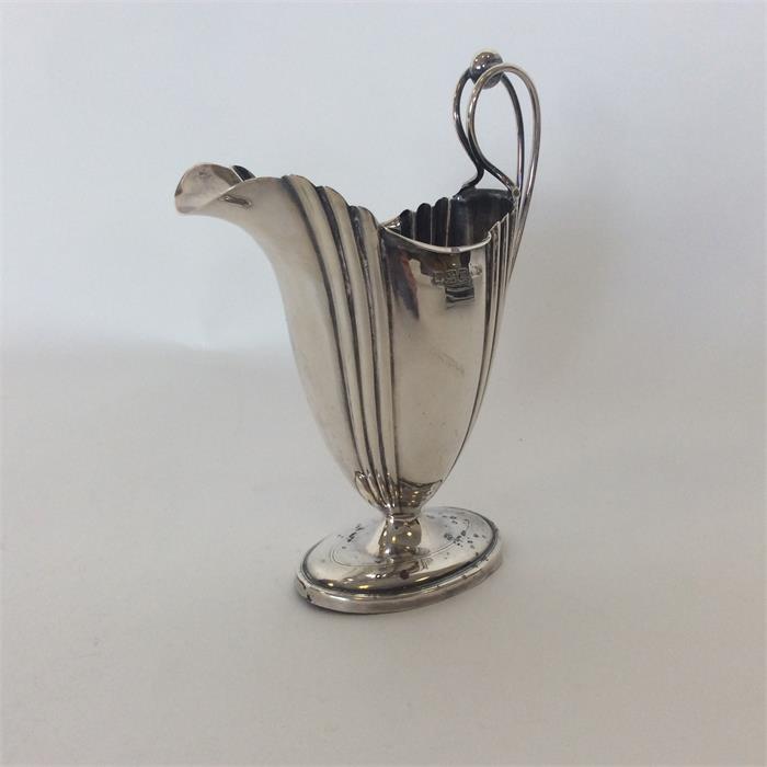 An Adams' style helmet shaped silver cream jug. Sh