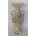 BELLEEK: A large two handled vase decorated with f