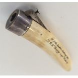 An unusual ivory cigar cutter with silver mount. A