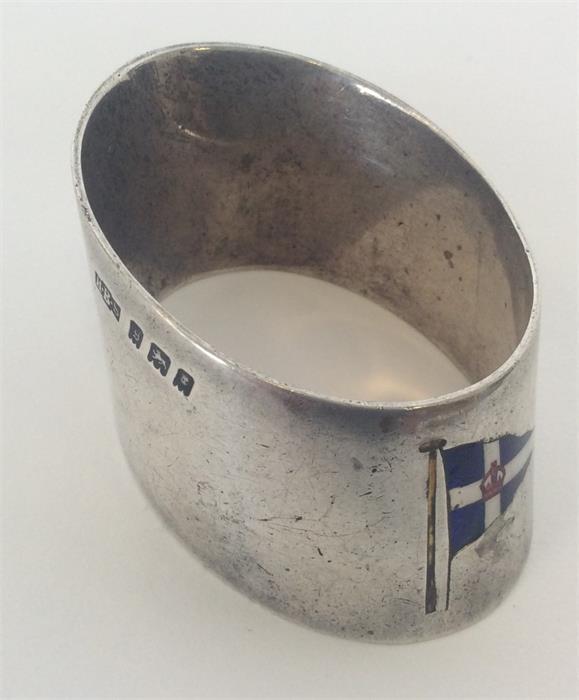 A good silver and enamelled napkin ring decorated