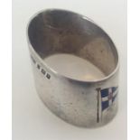 A good silver and enamelled napkin ring decorated
