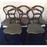 A set of five Victorian hoop back mahogany chairs