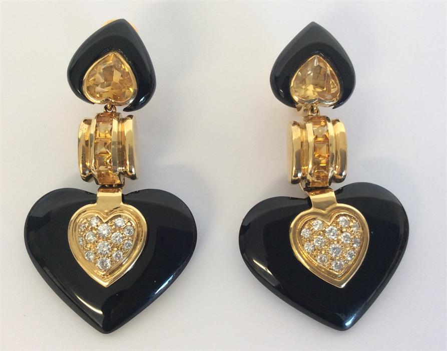 A pair of large onyx, diamond and citrine ear pend