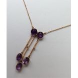 A good amethyst and pearl four stone necklet in go