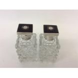 A pair of cut glass silver and tortoiseshell inlaid scent