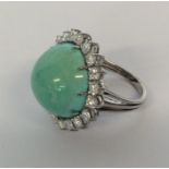 A large turquoise and diamond circular cluster rin