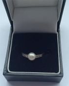 An Antique pearl and diamond seven stone ring in p