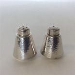 A pair of Chinese silver salts of tapering form. Signed t