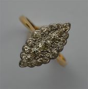 An Edwardian diamond marquise shaped ring in two c