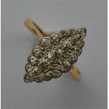 An Edwardian diamond marquise shaped ring in two c