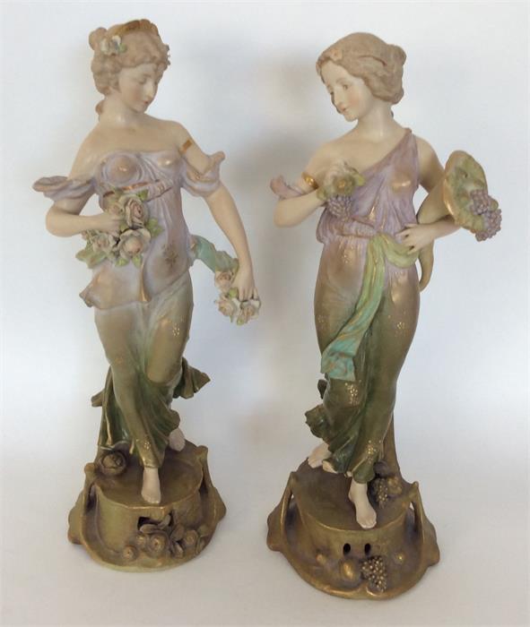 A pair of decorative Austrian Royal Vienna figures