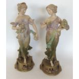 A pair of decorative Austrian Royal Vienna figures