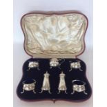 A large heavy cased seven piece silver cruet contained wi