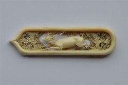 A finely carved ornament mounted with a stag in wo