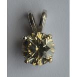 A large diamond single stone mounted as a pendant
