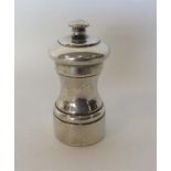 A large Continental silver pepper grinder of typic