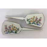 A pair of attractively enamelled silver hairbrushes decor
