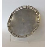 A large Gorham silver salver with pie crust rim. Approx.