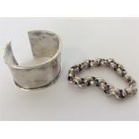 A heavy Continental silver bracelet together with