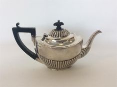 A small batchelors' half fluted silver teapot of typical