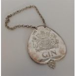 A heavy Commemorative Silver Jubilee silver gin label on suspension