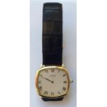 A slim 18 carat Cartier wristwatch with silvered d