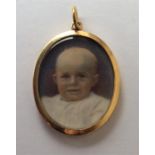 A good 15 carat miniature of a baby with loop top.