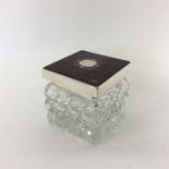 A square tortoiseshell and silver topped lidded ja