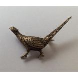 A small silver brooch in the form of a pheasant. App