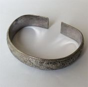 A good heavy Chinese slave bangle punched to inter