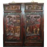 A pair of large Chinese carved wooden panels with