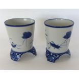 A pair of Japanese blue and white vases decorated