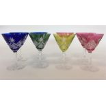 A set of eight coloured cut glass cocktail glasses
