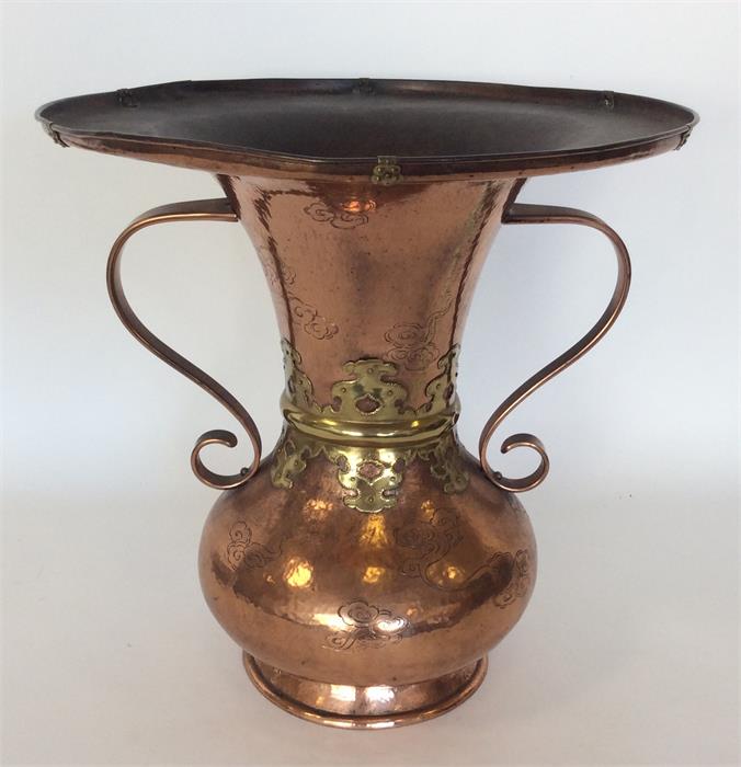 A massive Japanese copper vase with brass overlay.