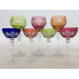 A set of three large coloured hock glasses togethe