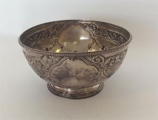A small Victorian silver sugar bowl decorated with