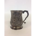 A George III silver embossed christening cup heavily deco
