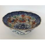 An Oriental blue ground bowl. Marked to base. Appr