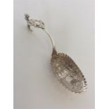 A Dutch silver ladle decorated with village scene bearing