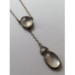 A small silver moonstone pendant. Est. £20 - £30.