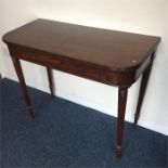 A Victorian hinged top card table with fluted supp