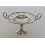A heavy silver two handled sweet dish on tapering