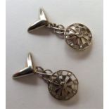 A pair of stylish platinum and gold cufflinks in t