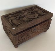 An Antique carved Indian stationery box on turned
