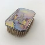 An attractively enamelled silver mounted brush of