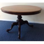 An oval Victorian mahogany tea table on turned sup