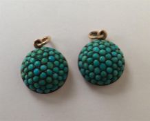 A pair of Antique turquoise pendants with gold loo